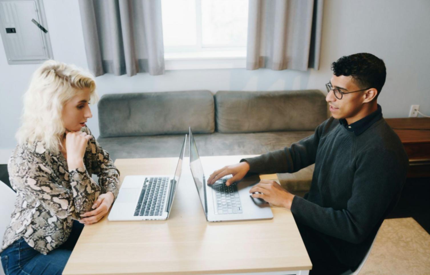 Strategic planning session with startup founders reviewing financial projections