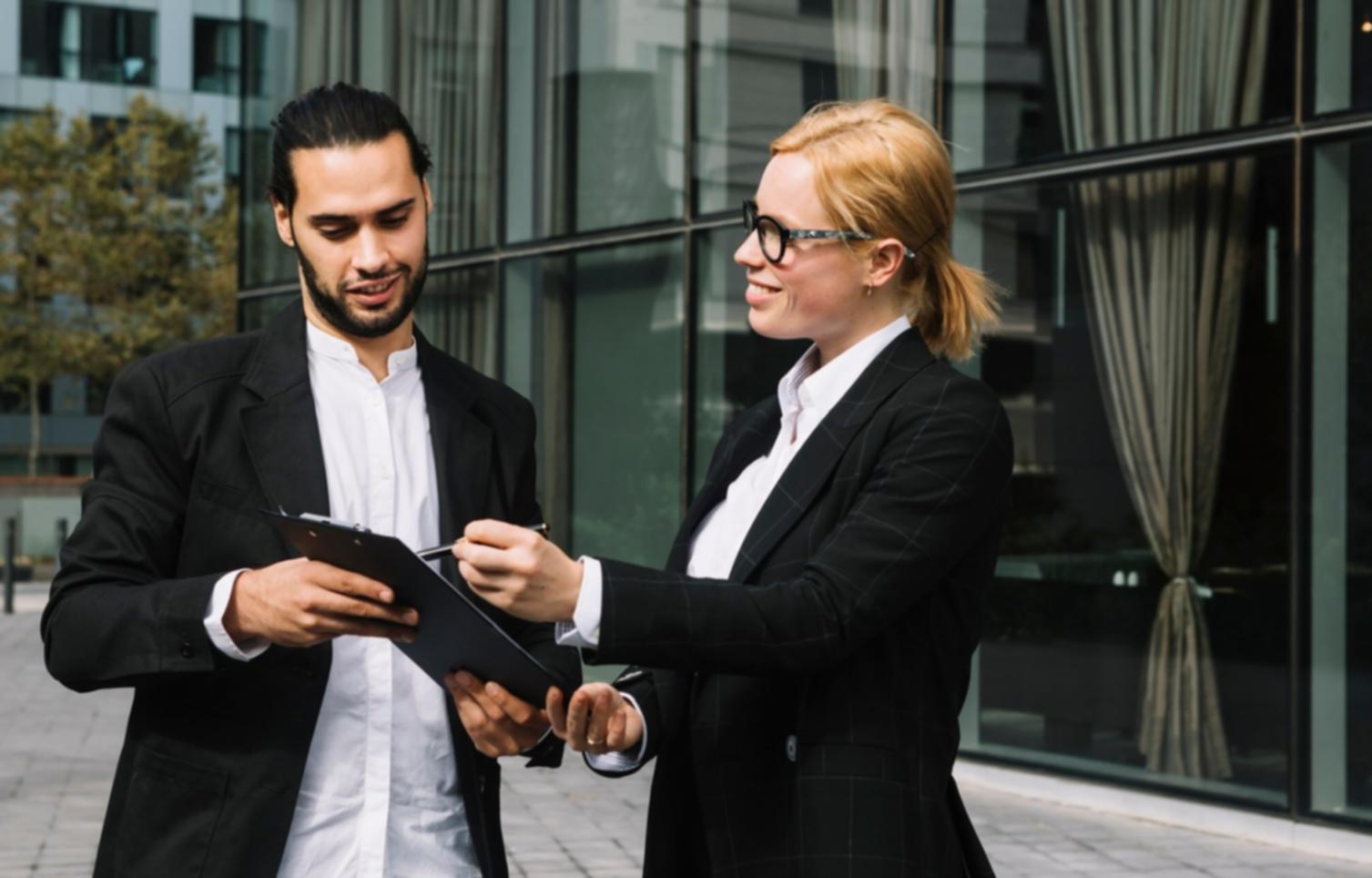 Professional consultation meeting between startup founders and funding advisors discussing business growth strategies